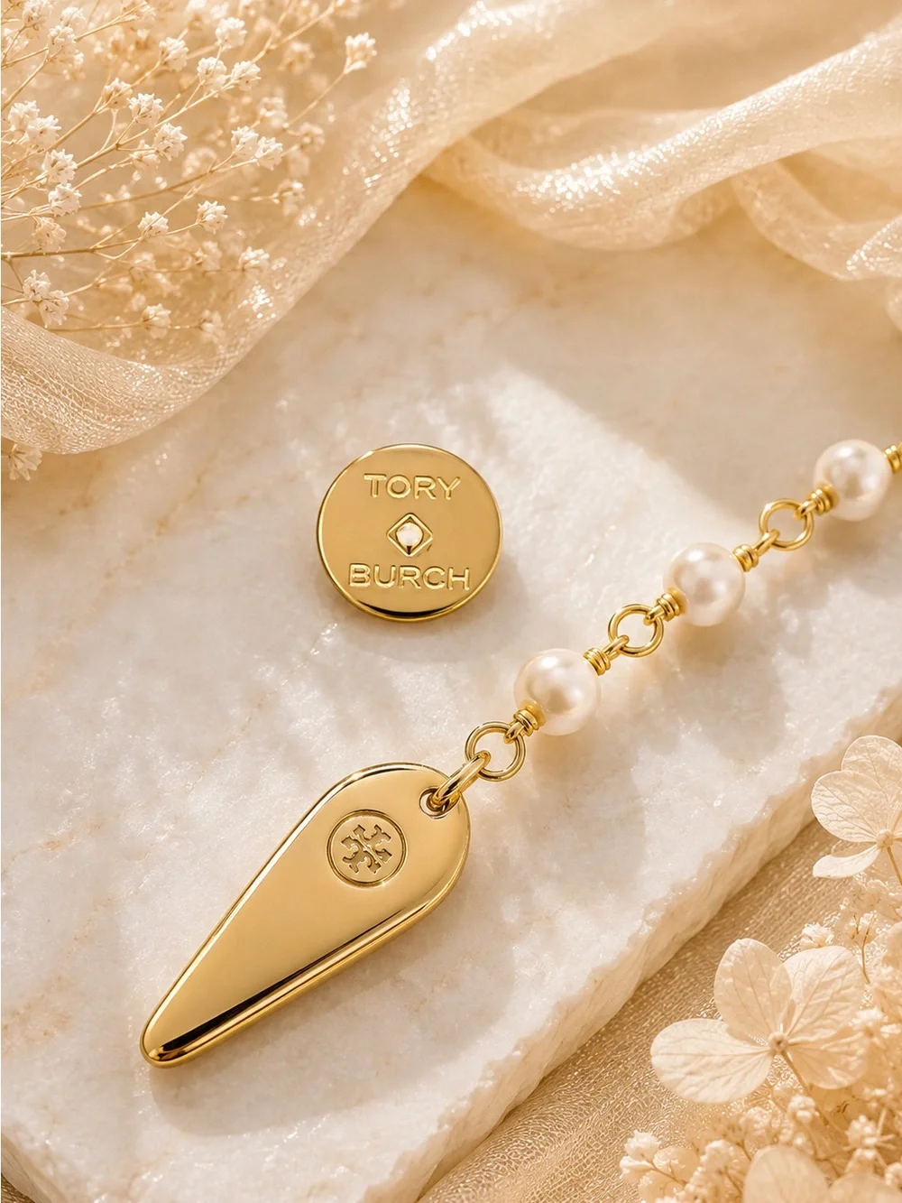 Tory Burch Snake Linear earring.